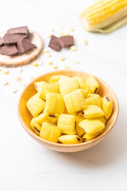 Chocolate cereals in a wooden bowl