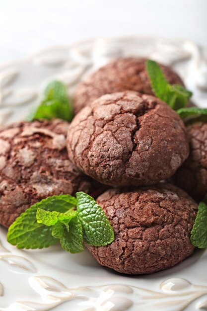 Chocolate chip cookie with mint in plate closeup