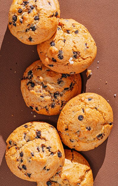 Chocolate chip cookies closeup on brown background