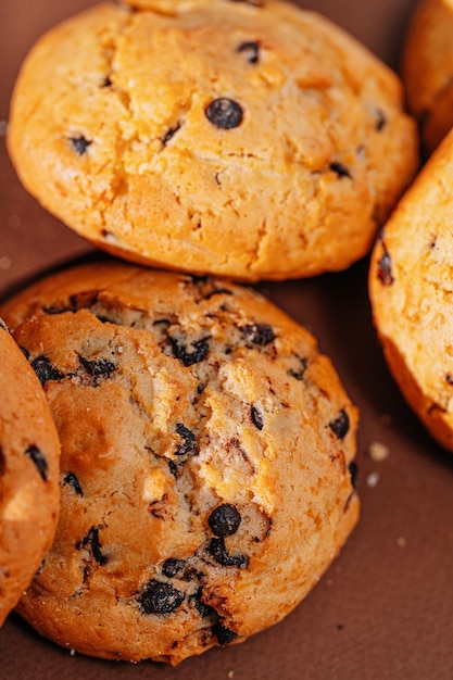 Chocolate chip cookies closeup on brown background