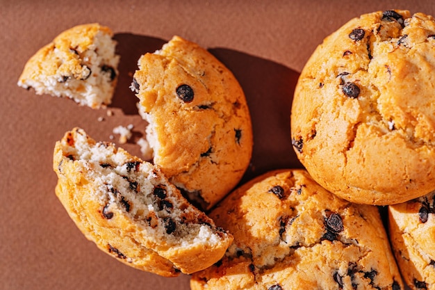 Chocolate chip cookies closeup on brown background