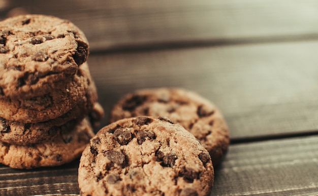 Chocolate chip cookies on old wooden table