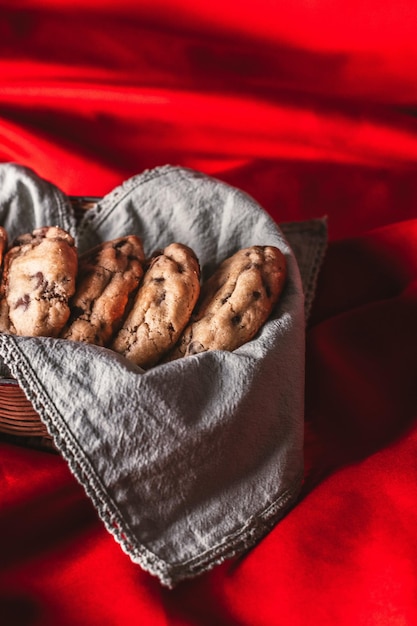 Chocolate Chip Cookies Placed in a Basket with Gray Cloth Photo