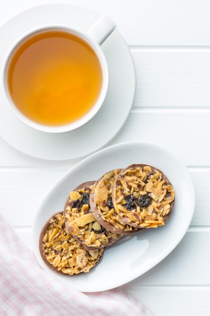 Chocolate chip cookies with nuts and raisins cookies with cup of tea