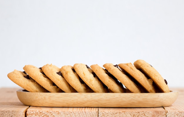 chocolate chip cookies on wooden plate