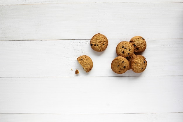 Chocolate chip cookies on wooden table. 