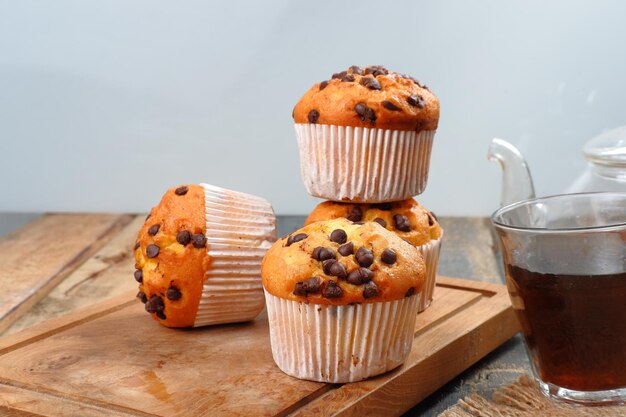 Chocolate chip muffins on grey background