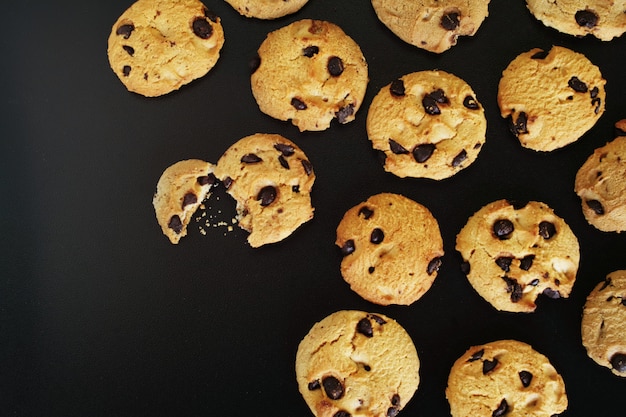 Chocolate Chips Cookies on black background.                               