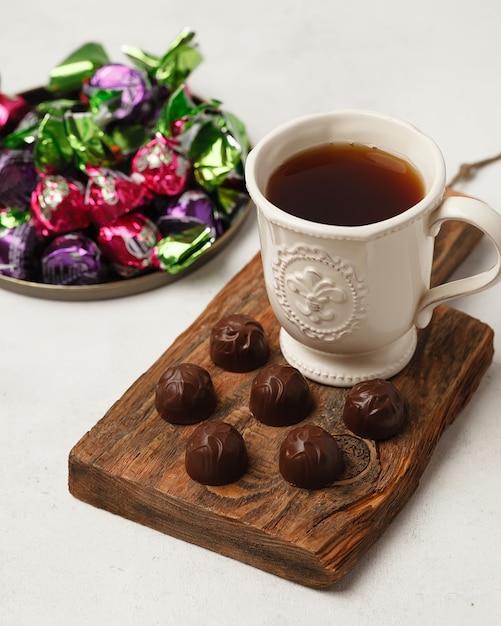 Chocolate and chocolate candy. Different chocolates and candies for coffee and tea.