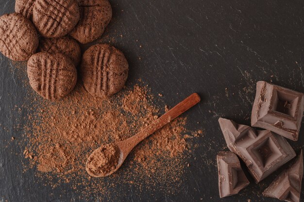 Chocolate and cocoa beans on dark background