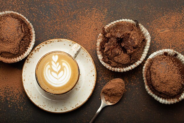 Chocolate and cocoa browny muffins with coffee cappuccino in