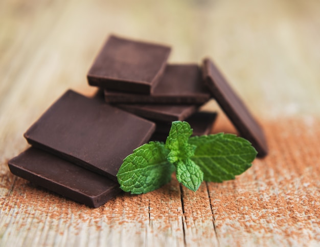 Chocolate and cocoa powder  on a old wooden table