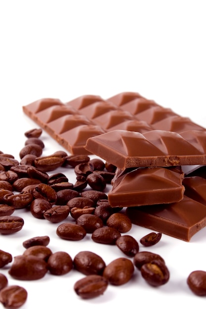 Chocolate and coffee beans on white background