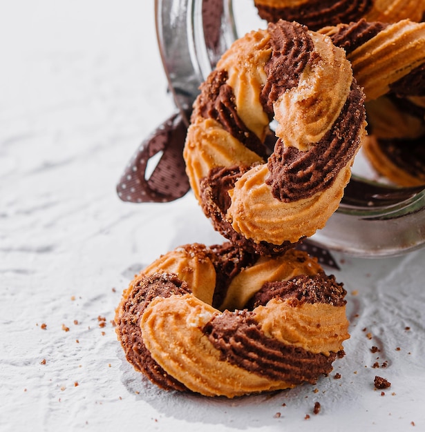 Chocolate cookies in a glass jar opened