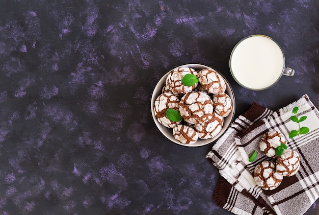 Chocolate cookies and a glass of milk. Top view