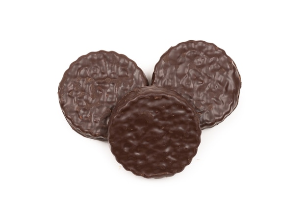 Chocolate cookies isolated on white surface. Copy space.