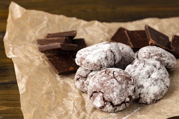 Chocolate cookies powdered with sugar close up