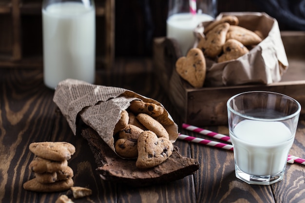 Chocolate cookies on wooden rustic table. Chocolate chip cookies in the shape of a heart. Homemade cookies