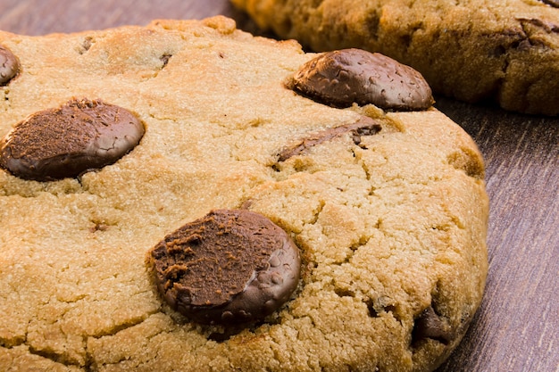 Chocolate cookies on wooden table. Close-up Macro. Selective focus.