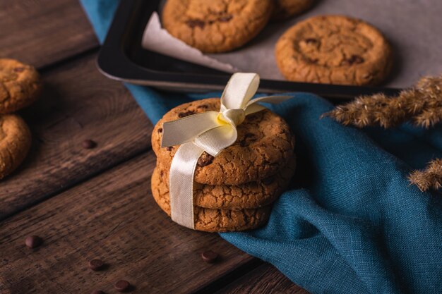 Chocolate cookies on a wooden table decorated with a blue napkin