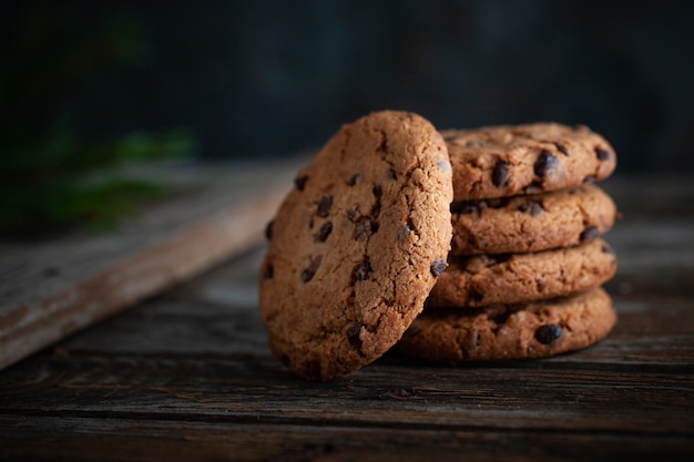 Chocolate cookies on wooden table.