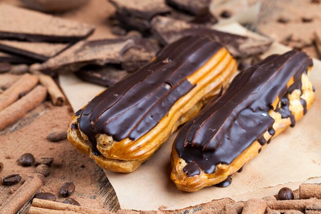 Chocolate-covered custard eclair with creamy chocolate cream