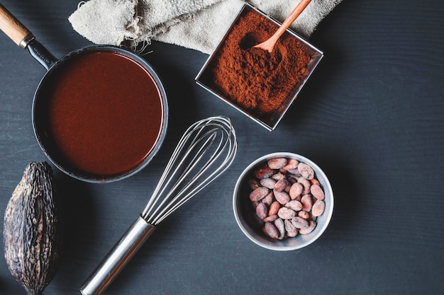 Chocolate cream and chocolate powder on the table