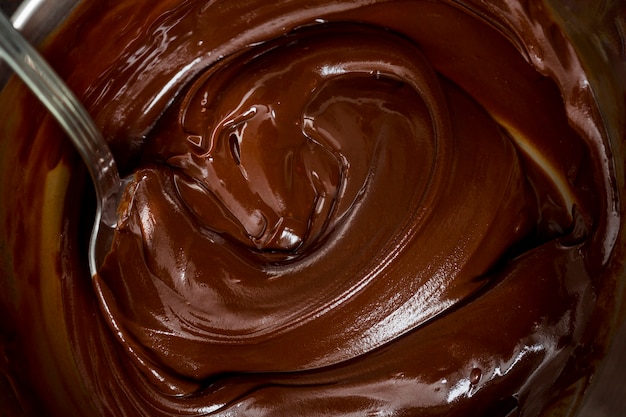 Foto crema di cioccolato e un cucchiaio