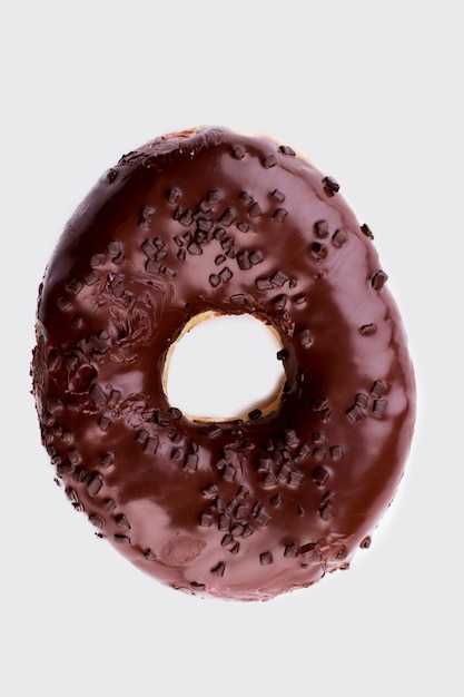 Chocolate crunch doughnut, top view.