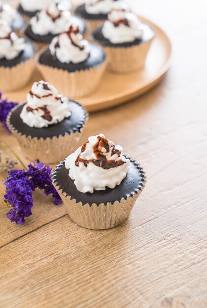 chocolate cup cake with whipped cream