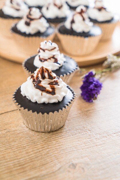 chocolate cup cake with whipped cream