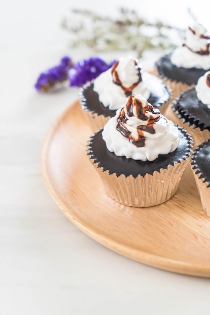 chocolate cup cake with whipped cream