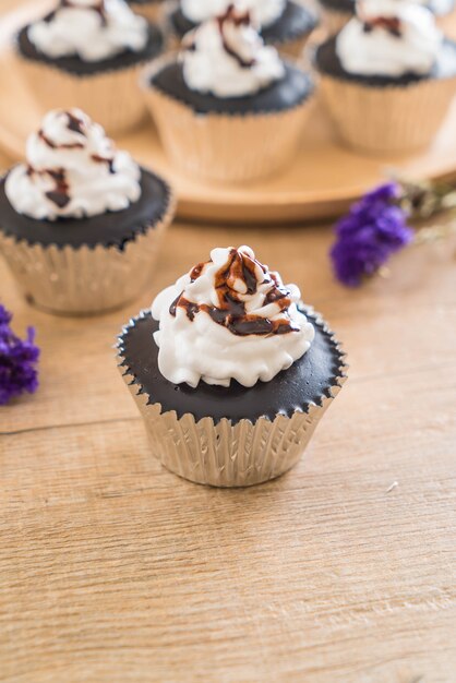 chocolate cupcake with whipped cream