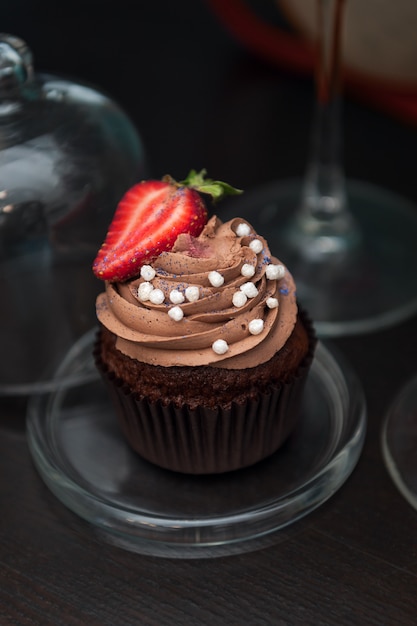 Chocolate cupcakes with strawberry.