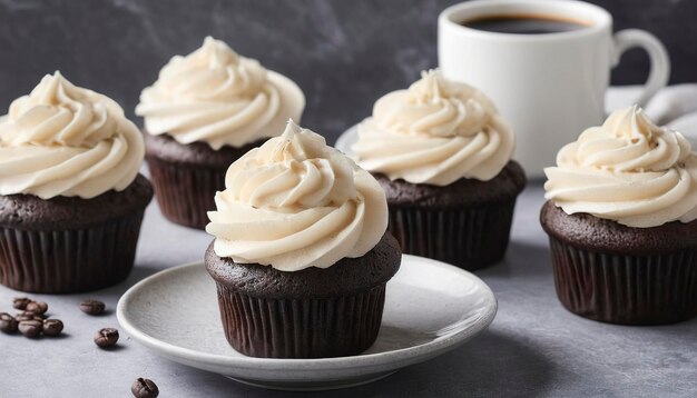 Chocolate cupcakes with vanilla frosting and a cup of coffee