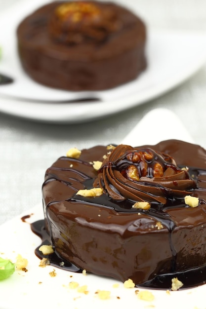 Chocolate dessert with decoration on white plate