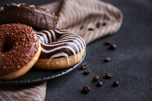 Chocolate donuts and coffee beans sweet delicious baked dessert