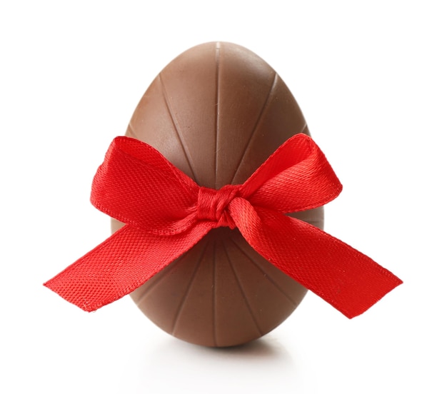 Chocolate Easter egg with color ribbon bow isolated on white