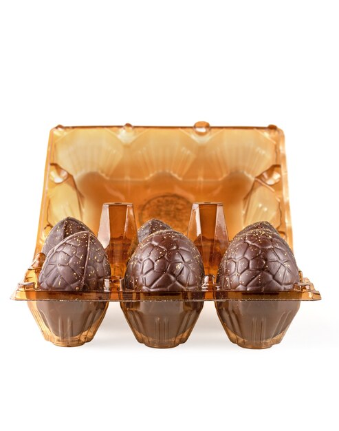 Chocolate Easter eggs in a tray, isolated.