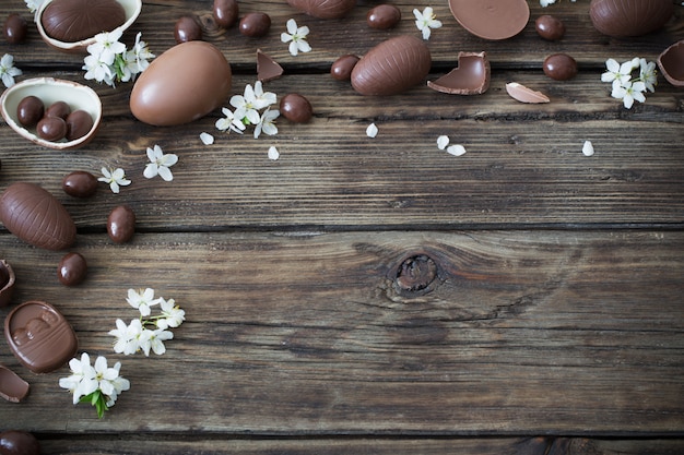 Chocolate eggs on dark wooden background