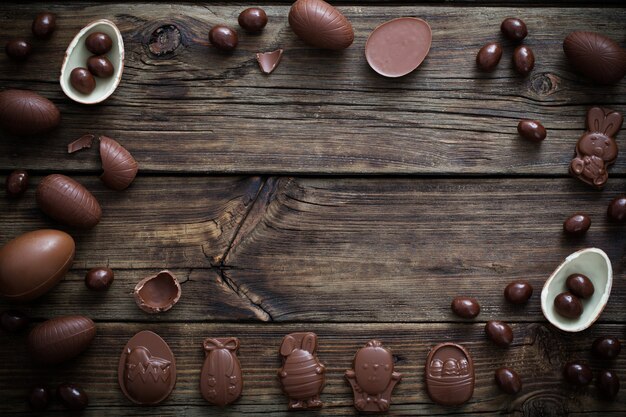 Chocolate eggs on dark wooden background