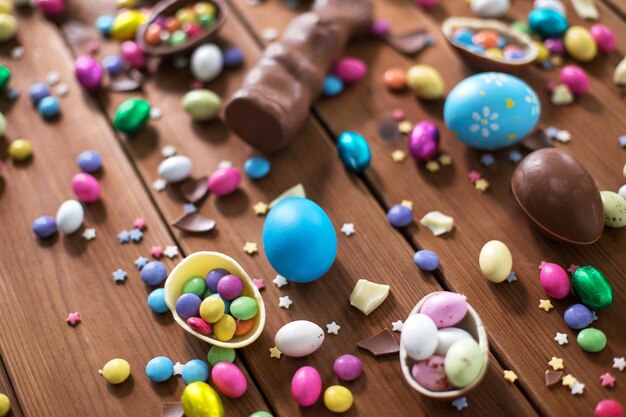 chocolate eggs easter bunny and candies on wood