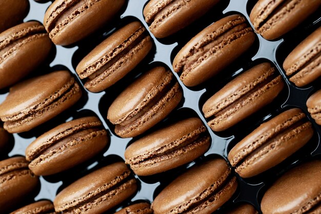 Chocolate-flavored French macaroons are in the bakery.