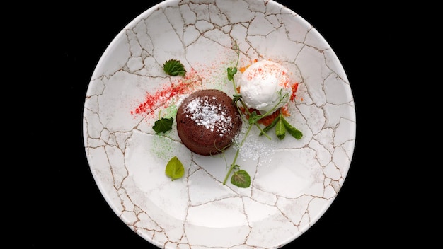 Chocolate fondant with ice cream on a plate