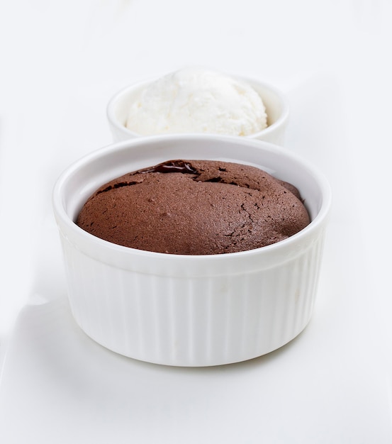 Chocolate fondant with ice cream on white background