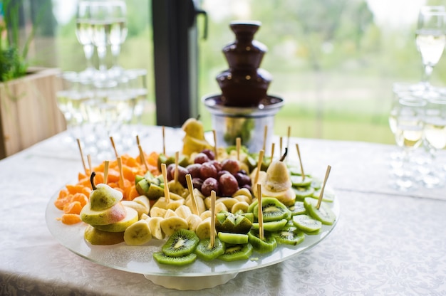 Chocolate fountain on the buffet table in the restaurant