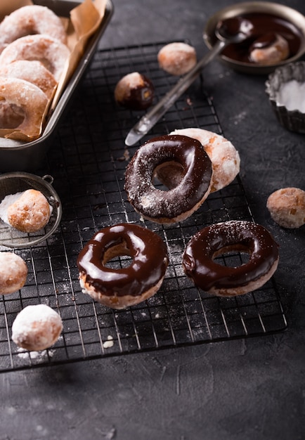 Chocolate frosted donuts and sugar coated donuts