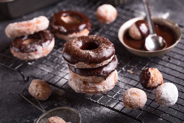 Chocolate frosted donuts and sugar coated donuts