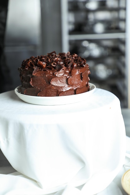 Chocolate Fudge Cake served on food table top view cafe bake dessert