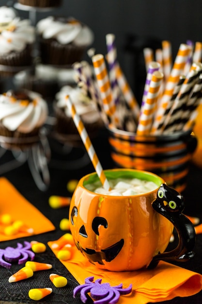 Chocolate Halloween cupcakes with white buttercreme icing and chocolate shavings on top.